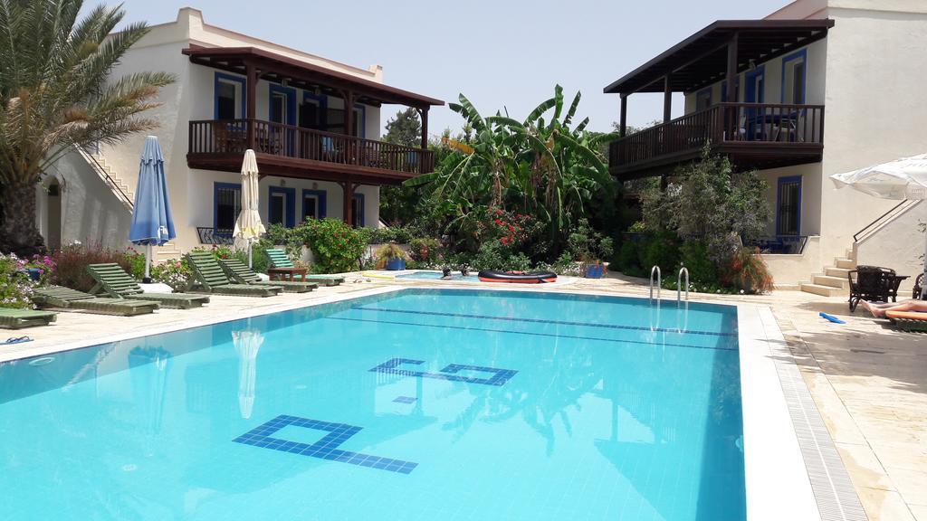 אפרטהוטל Paradise Garden Gumusluk Evleri מראה חיצוני תמונה